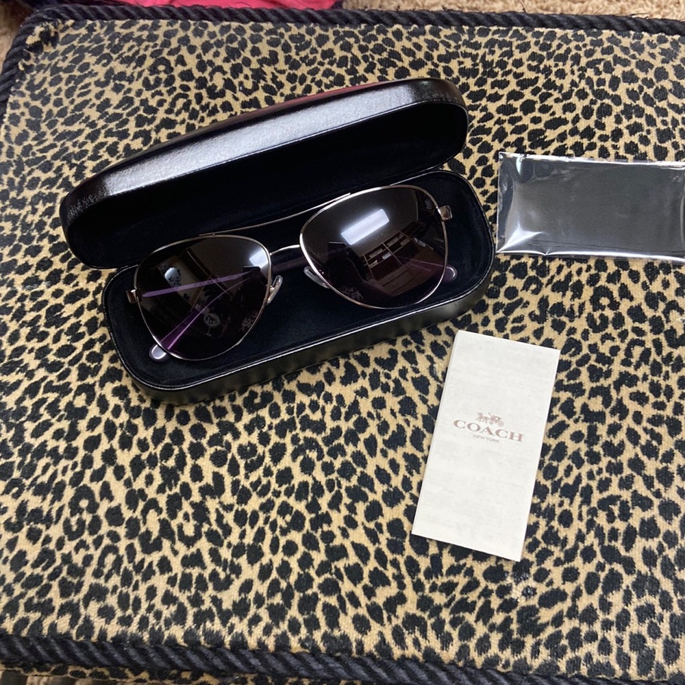 Coach sunglasses. Never worn. Too small for my big head.